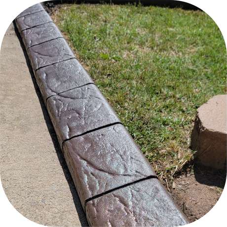 Spanish stamped concrete curb pattern installed by Killer Curbz