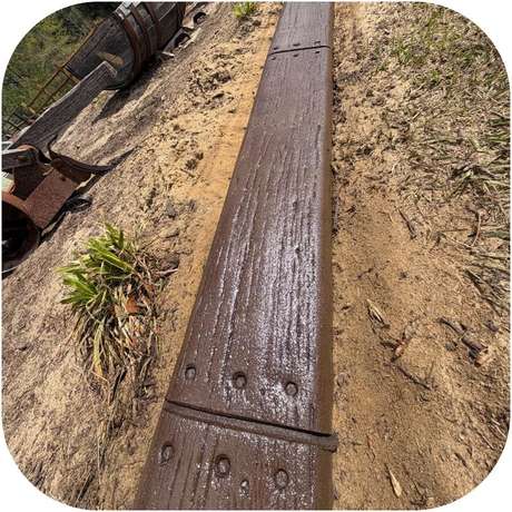 Wood Grain stamped concrete curb pattern installed by Killer Curbz